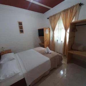 Postel nebo postele na pokoji v ubytování Nirvana House Calima Darien