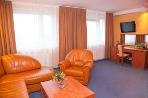 TV a/nebo společenská místnost v ubytování Hotel IKAR