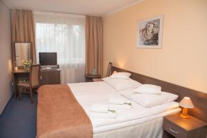 Postel nebo postele na pokoji v ubytování Hotel IKAR