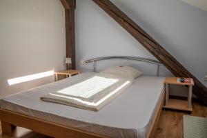 a bedroom with a large bed with a wooden frame at Hotel Garni FairSchlafen in Minden