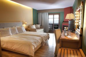 Posteľ alebo postele v izbe v ubytovaní Kazarma Hotel