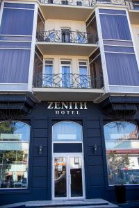 a building with the name of a hotel at Zenith Hotel in Odesa