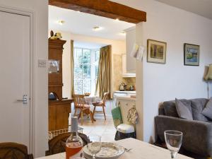 a living room with a couch and a table at Hallams Yard in Skipton