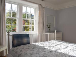 Cama o camas de una habitación en Ardchoille Cottage