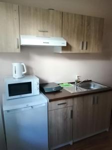 A kitchen or kitchenette at Widokowa Apartament