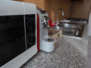 A kitchen or kitchenette at Relax&Natura a 6 minuti da BRESCIA Wifi a Rezzato