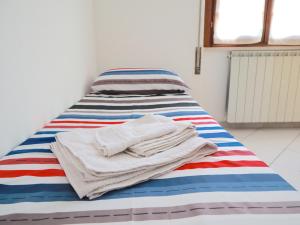 A bed or beds in a room at Relax&Natura a 6 minuti da BRESCIA Wifi a Rezzato