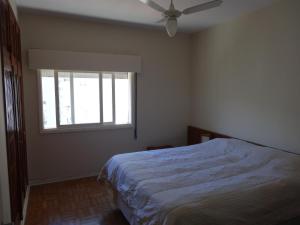 Cama o camas de una habitación en Apartamento Pitangueiras