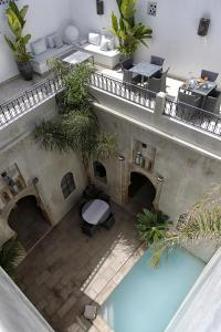 an overhead view of a building with a swimming pool at Riad Dar Zen in Rabat