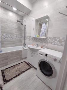 Ванная комната в Уютная квартира-студия ЖК Lotus Terrace