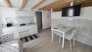 Kuchyň nebo kuchyňský kout v ubytování Casa lagunare haus