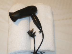 a blow dryer sitting on top of a towel at Grey Mullet Guesthouse in St Ives