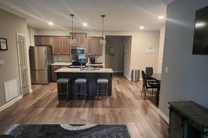 a large kitchen with a island in the middle at Luxury 2 Bedroom 2 Bath and 1 Car Garage with Pool in Memphis