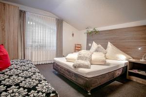 Postel nebo postele na pokoji v ubytování Apartments Renata Gries 201