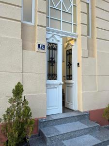 a pair of doors on a building with stairs at Gramophone Apartments in Bitola