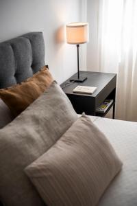 A bed or beds in a room at Avanti Luz de Sevilla, hazte un regalo y disfrutalo