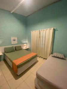 Lova arba lovos apgyvendinimo įstaigoje Ampla casa de 3 quartos com piscina