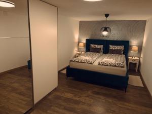 a bedroom with a large bed in a room at Kod Dida in Gospić