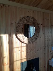 a mirror on the wall of a room at Sunset View Shepherds Hut in Dalmally