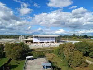 an aerial view of a large building in a field at ARENA in Osijek