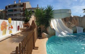 a water slide in a theme park with a water slide at 30º Hotels - Hotel Pineda Splash in Pineda de Mar