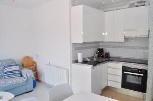 Kuchyňa alebo kuchynka v ubytovaní Sehr schöne Ferienwohnung auf Portocolom, Mallorca