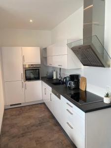 Kuchyň nebo kuchyňský kout v ubytování Gemütliche Neubauwohnung 70qm