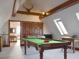 a room with a pool table in it at Swallow Barn in Banbury
