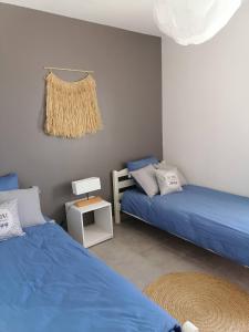 Postel nebo postele na pokoji v ubytování Gite la Picholine_Bourg Saint Andéol