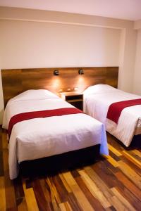 Postel nebo postele na pokoji v ubytování Zans Apartments Cusco