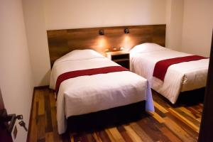Postel nebo postele na pokoji v ubytování Zans Apartments Cusco