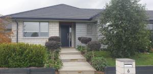 a house with a wooden walkway leading to a door at Cambridge Retreat B&B in Cambridge +5 photos