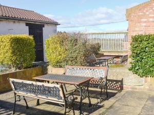 two benches and a table and a table and chairs at Barley Mill - Uk11148 in Eshott