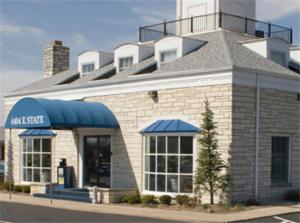 a building on the side of a street at Alpine Inn & Suites Rockford in Rockford