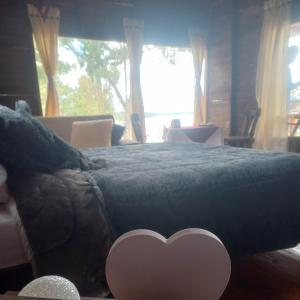 Postel nebo postele na pokoji v ubytování Cabaña Sueños Dorados
