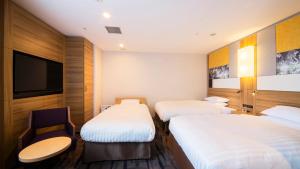 Posteľ alebo postele v izbe v ubytovaní JR-East Hotel Mets Kokubunji