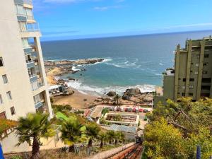 a view of the ocean from a building at Reñaca Frente al Mar in Viña del Mar