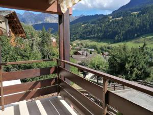 a balcony with a view of the mountains at Appartement Le Grand-Bornand, 1 pièce, 4 personnes - FR-1-241-242 in Le Grand-Bornand