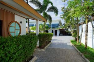 a walkway in front of a house at Annowa Resort - Chanthaburi in Chanthaburi