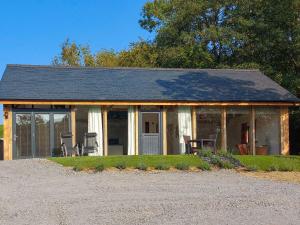 a screened in porch of a house with chairs at The Hideaway in Highgate