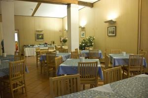 a restaurant with tables and chairs in it at Casa Sant'Andrea in Venice