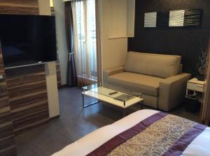 TV a/nebo společenská místnost v ubytování Amand Hotel