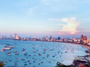 a group of boats in the water in a city at THE BASE holiday in in Pattaya Central