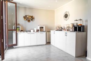 A cozinha ou kitchenette de Carlo Goldoni Hotel
