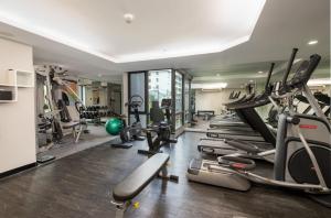 a gym with a bunch of treadmills and machines at RakYim Siam - Sukhumvit 15 in Bangkok