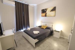 Postel nebo postele na pokoji v ubytování Golden Milano Hotel