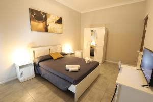 Postel nebo postele na pokoji v ubytování Golden Milano Hotel