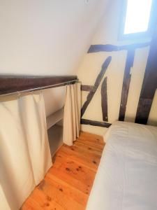 Posteľ alebo postele v izbe v ubytovaní Loft atypique au calme avec cour privative