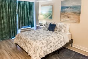 a bedroom with a bed and a large window at Daytona Beach Resort 805 in Daytona Beach