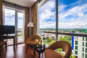 a hotel room with a view of a city at Mondial Hotel in Hue